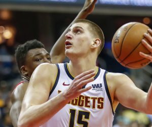 epa08505950 (FILE) - Denver Nuggets center Nikola Jokic (R) in action against Washington Wizards center Thomas Bryant (L) during the NBA basketball game between the Denver Nuggets and the Washington Wizards in Washington, DC, USA, 21 March 2019 (re-issued on 24 June 2020). Serbian basketball player Nikola Jokic of the Denver Nuggets was tested positive for the coronavirus COVID-19 disease, the Denver Post confirmed on late 23 June 2020. Jokic met Serbian tennis player Novak Djokovic during the Adria Tour tennis tournament in Belgrade.  EPA/ERIK S. LESSER SHUTTERSTOCK OUT