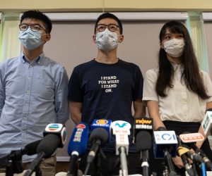 epa08516928 (FILE) - Members of the pro-democracy political group Demosisto, Joshua Wong (L), Nathan Law (C) and Agnes Chow (R) speak during a press conference in Hong Kong, China, 30 May 2020 (reissued 30 June 2020). The three members of Demosisto on 30 June announced quitting the Hong Kong pro-democracy group shortly after media reported that China had passed the controversial national security law.  EPA/JEROME FAVRE