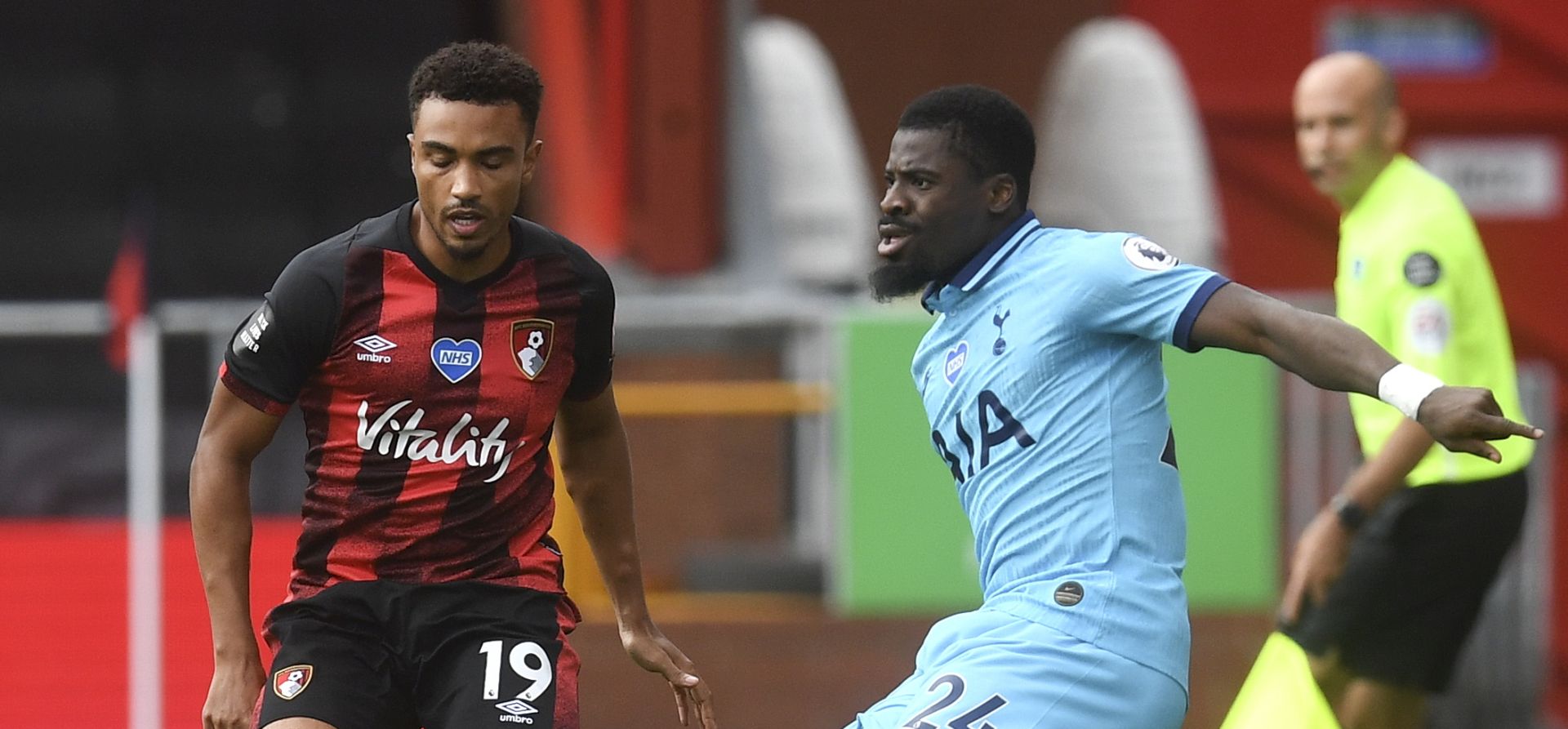 epa08537032 Junior Stanislas (L) of Bournemouth in action against Serge Aurier (R) of Tottenham during the English Premier League match between AFC Bournemouth and Tottenham Hotspur in Bournemouth, Britain, 09 July 2020.  EPA/Neil Hall/NMC/Pool EDITORIAL USE ONLY. No use with unauthorized audio, video, data, fixture lists, club/league logos or 'live' services. Online in-match use limited to 120 images, no video emulation. No use in betting, games or single club/league/player publications.