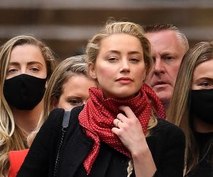 epa08543861 US actress Amber Heard (C) departs the Royal Courts of Justice with her legal team in London, Britain, 13 July 2020. Heard's ex-husband US actor Johnny Depp is suing The Sun's newspaper publisher News Group Newspapers (NGN) over claims he abused his ex-wife.  EPA/ANDY RAIN