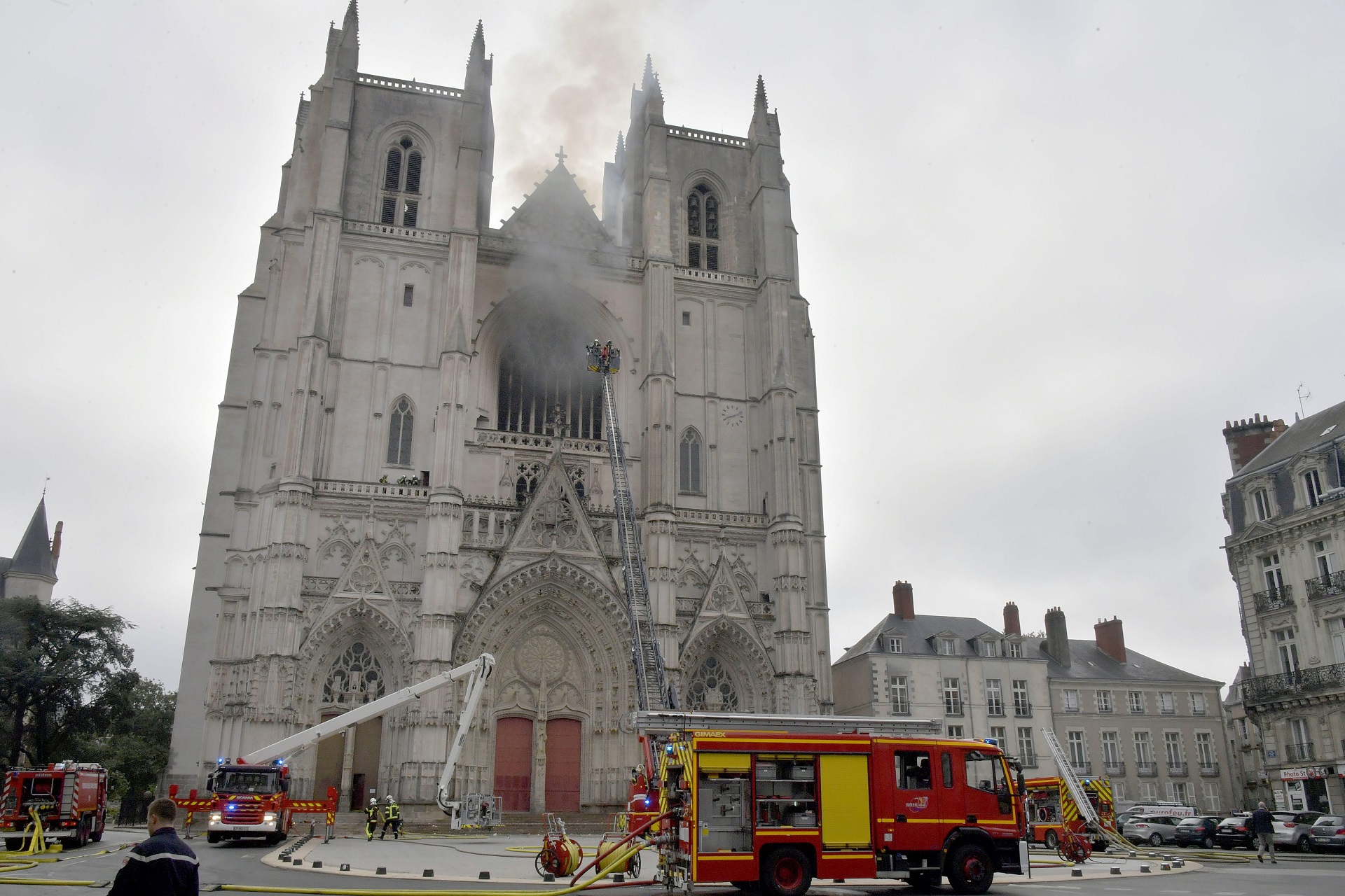 epa08553437 Fire fighters brigade work to extinguish the blaze at the Saint Peter and Saint Paul Cathedral, in Nantes, France, 18 July 2020. The blaze that broke inside the gothic cathedral of Nantes 18 has been contained, emergency officials said.   FRANCE OUT / SHUTTERSTOCK OUT