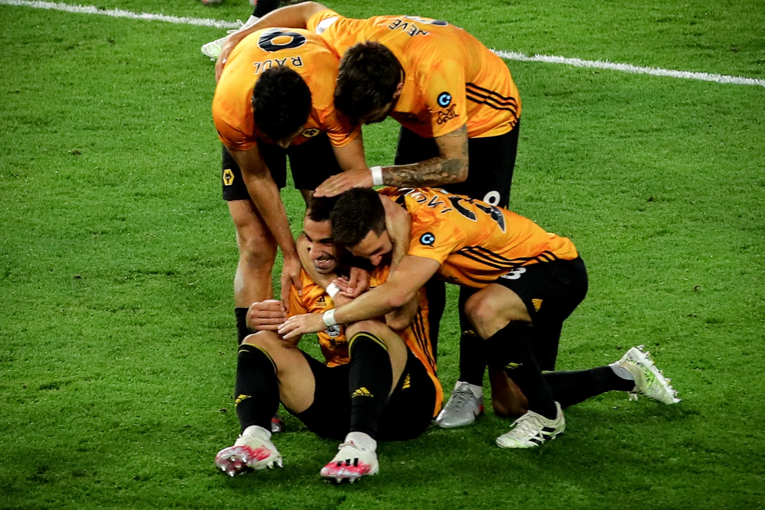 epa08557242 Wolverhampton's Jonny (bottom-L) celebrates with his teammates after scoring the 2-0 lead during the English Premier League soccer match between Wolverhampton Wanderers and Crystal Palace in Wolverhampton, Britain, 20 July 2020.  EPA/Richard Heathcote/NMC/Pool EDITORIAL USE ONLY. No use with unauthorized audio, video, data, fixture lists, club/league logos or 'live' services. Online in-match use limited to 120 images, no video emulation. No use in betting, games or single club/league/player publications.