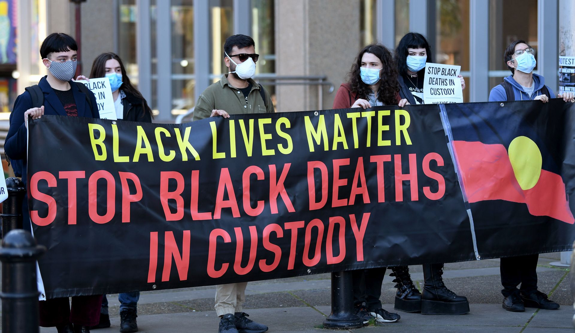 epaselect epa08561729 Black Lives Matters (BLM) supporters gather during a press conference outside the Supreme Court of New South Wales (NSW) in Sydney, Australia, 23 July 2020. Organisers of the Black Lives Matter - I Can't Breathe - Justice Now rally are defending their protest plans in the NSW Supreme Court, with the rally planned for July 28.  EPA/BIANCA DE MARCHI AUSTRALIA AND NEW ZEALAND OUT