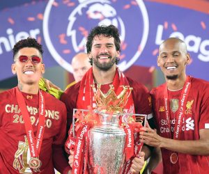 epa08562253 Liverpool's Brazilian players (L-R), Roberto Firmino, Alisson Becker and Fabinho celebrate with the trophy the Premier League 2020 title following the English Premier League soccer match between Liverpool FC and Chelsea FC in Liverpool, Britain, 22 July 2020.  EPA/Laurence Griffiths/NMC/Pool EDITORIAL USE ONLY. No use with unauthorized audio, video, data, fixture lists, club/league logos or 'live' services. Online in-match use limited to 120 images, no video emulation. No use in betting, games or single club/league/player publications.