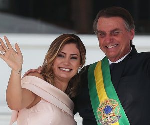 epa08574807 (FILE) - President of Brazil, Jair Bolsonaro, hugs his wife Michelle de Paula Firmo (L), during his presidential inauguration ceremony in Brasilia, Brazil, 01 January 2019 (reissued 30 July 2020). The Brazilian first lady, 38, has tested positive for COVID-19, an illness from which Bolsonaro recovered last weekend, official sources reported on 30 July 2020.  EPA/MARCELO SAYAO