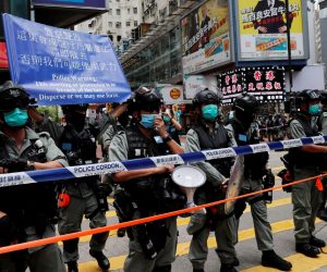 Riot police stand in line as anti-national security law protesters march at the anniversary of Hong Kong's handover to China from Britain in Hong Kong Riot police stand in line as anti-national security law protesters march at the anniversary of Hong Kong's handover to China from Britain in Hong Kong, China July 1, 2020. REUTERS/Tyrone Siu TYRONE SIU