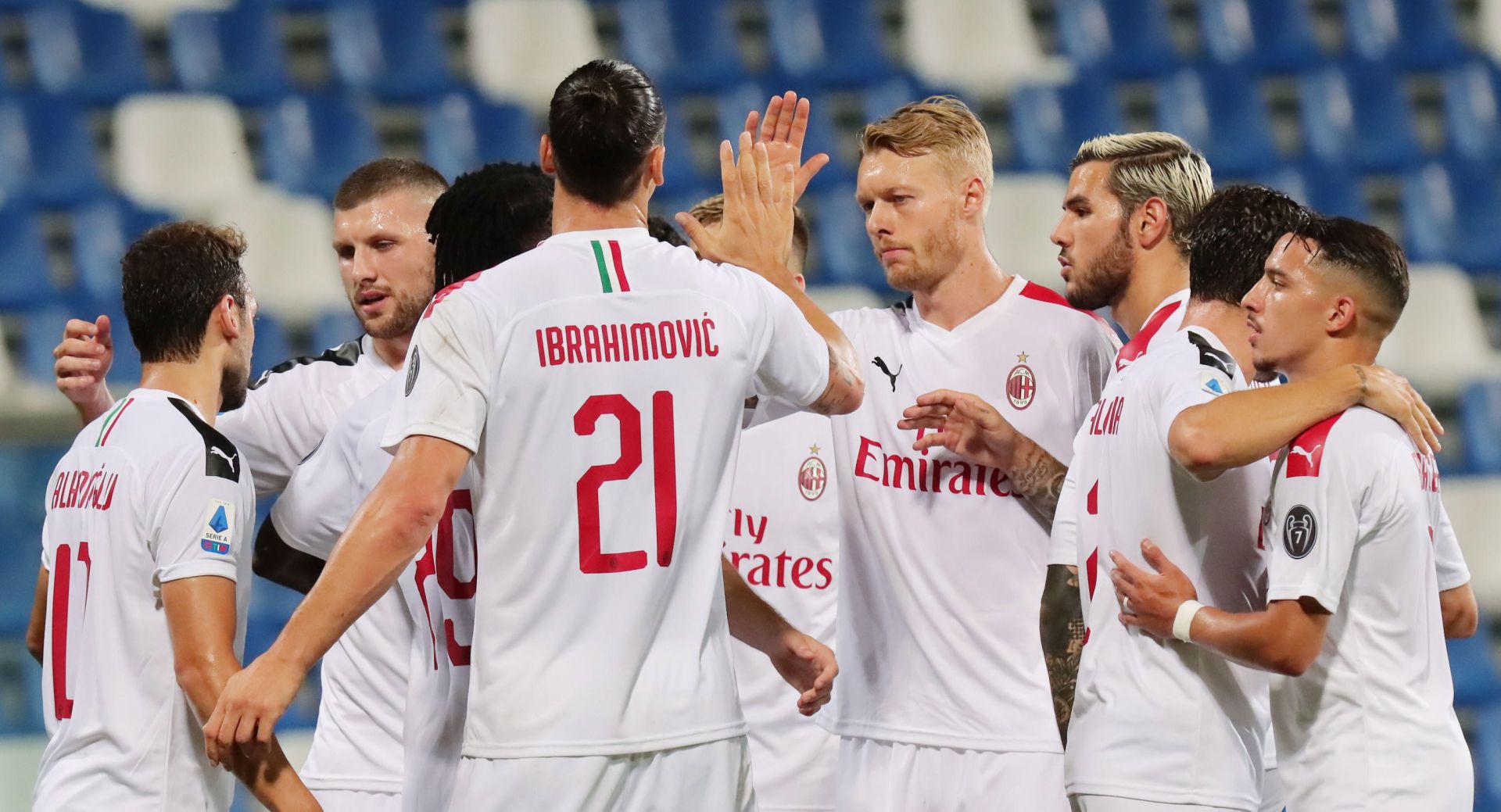 epa08559311 Milan's Zlatan Ibrahimovic (front) celebrates with teammates after scoring during the Italian Serie A soccer match US Sassuolo vs AC Milan at Mapei Stadium in Reggio Emilia, Italy, 21 July 2020.  EPA/ELISABETTA BARACCHI