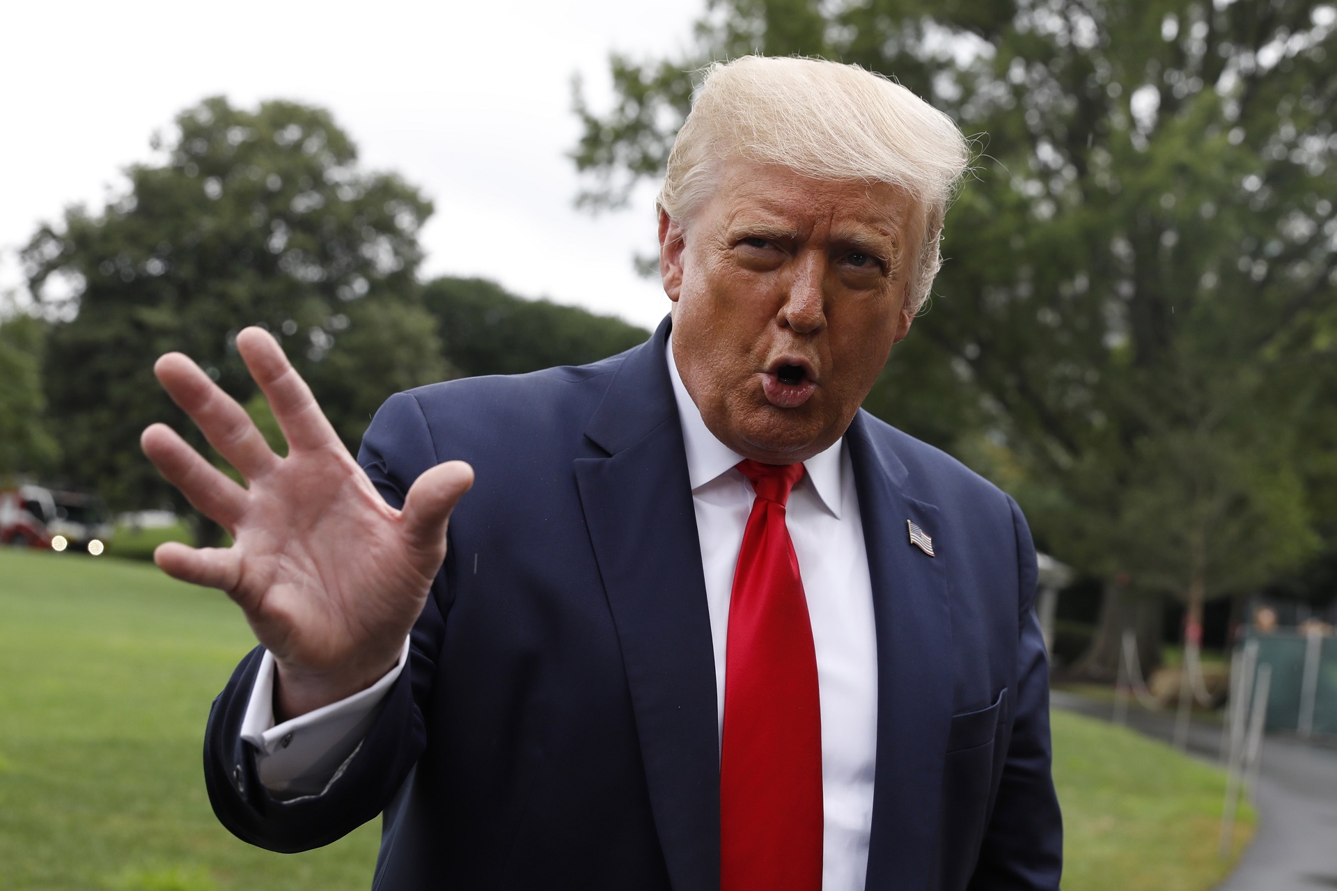 epa08577755 US President Donald J. Trump speaks to the media on the South Lawn of the White House in Washington, DC, USA, 31 July 2020, before his departure to Tampa, Florida.  EPA/Yuri Gripas / POOL