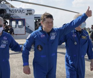 epa08581202 A handout photo made available by NASA shows astronaut Robert Behnken (C) arriving at Naval Air Station Pensacola in Pensacola, Florida, USA, 02 August 2020. The Demo-2 test flight for NASA's Commercial Crew Program was the first to deliver astronauts to the International Space Station and return them safely to Earth onboard a commercially built and operated spacecraft.  EPA/Bill Ingalls HANDOUT MANDATORY CREDIT: NASA/Bill Ingalls HANDOUT EDITORIAL USE ONLY/NO SALES