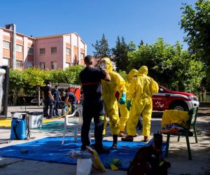 epa08583027 Local firefighters disinfect a care home in Burbaguena, Teruel, Spain, 04 August 2020. A Coronavirus outbreak has been detected in a care home in Burbaguena.  EPA/Antonio Garcia