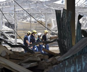 epa08589337 Members of German Federal Agency for Technical Relief (THW) search for bodies and survivors amid the rubble three days after explosions that hit Beirut port, in Beirut, Lebanon, 07 August 2020. According to the Lebanese Health Ministry, at least 137 people were killed, and more than 5,000 injured in the blast believed to have been caused by an estimated 2,750 tons of ammonium nitrate stored in a warehouse. The explosion and its shockwave on 04 August 2020 devastated the port area.  EPA/WAEL HAMZEH