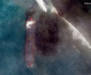 epa08590349 A handout satellite image made available by MAXAR Technologies shows the MV Wakashio, a bulk carrier ship that recently ran aground off the southeast coast of Mauritius, 07 August 2020. The ship was sailing from China to Brazil when it hit coral reefs near Pointe d’Esny on July 25. The ship is leaking a considerable amount of oil into the ocean and the oil slick is drifting northwest and to the shore. According to news reports, the ship was carrying 3,894 metric tons of low sulfur fuel oil, 207 metric tons of diesel and 90 metric tons of lubricant oil. In the link provided below is a gallery of satellite images that focuses on the ship stuck on the coral reefs, including imagery collected on August 1 that shows the ship before it started leaking oil, and imagery collected this morning (August 7) that shows the ship sinking into the ocean and oozing oil.  EPA/MAXAR TECHNOLOGIES / HANDOUT -- MANDATORY CREDIT: SATELLITE IMAGE 2020 MAXAR TECHNOLOGIES -- the watermark may not be removed/cropped -- HANDOUT EDITORIAL USE ONLY/NO SALES