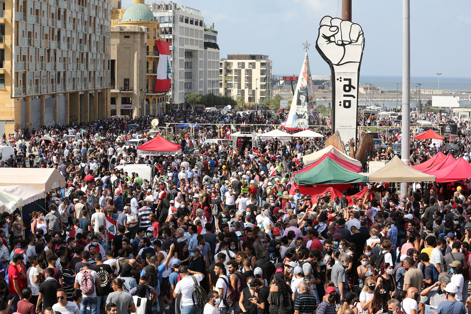 epa08591561 Lebanese people gather for a protest in the aftermath of explosion four days earlier, in Beirut, Lebanon, 08 August 2020. People gathered to protest against the political leaders and calling on those responsible over the explosion to be held accountable. Lebanese Health Ministry on 07 August said at least 154 people were killed, and more than 5,000 injured in the Beirut blast that devastated the port area on 04 August and believed to have been caused by an estimated 2,750 tons of ammonium nitrate stored in a warehouse.  EPA/Nabil Mounzer