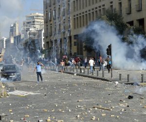 epa08592097 Anti-government protesters clash with Lebanese riot police during a protest outside of the Lebanese Parliament in downtown Beirut, Lebanon, 08 August 2020. People gathered for the so-called 'the Saturday of the hanging ropes' to protest against the political leaders and calling on those responsible over the explosion to be held accountable. Lebanese Health Ministry on 07 August said at least 154 people were killed, and more than 5,000 injured in the Beirut blast that devastated the port area on 04 August and believed to have been caused by an estimated 2,750 tons of ammonium nitrate stored in a warehouse.  EPA/WAEL HAMZEH