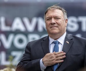 epa08597506 US Secretary of State Mike Pompeo listens to US national anthem as he commmemorates the liberation of Western Czechoslovakia by the US army at the end of WWII, at the monument 'Thank you America!' in Plzen, Czech Republic, 11 August 2020. Pompeo is on an official two-day visit to the Czech Republic.  EPA/MARTIN DIVISEK