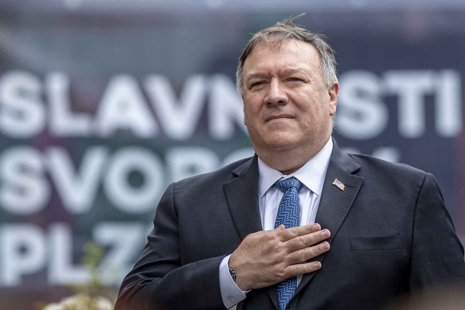 epa08597506 US Secretary of State Mike Pompeo listens to US national anthem as he commmemorates the liberation of Western Czechoslovakia by the US army at the end of WWII, at the monument 'Thank you America!' in Plzen, Czech Republic, 11 August 2020. Pompeo is on an official two-day visit to the Czech Republic.  EPA/MARTIN DIVISEK
