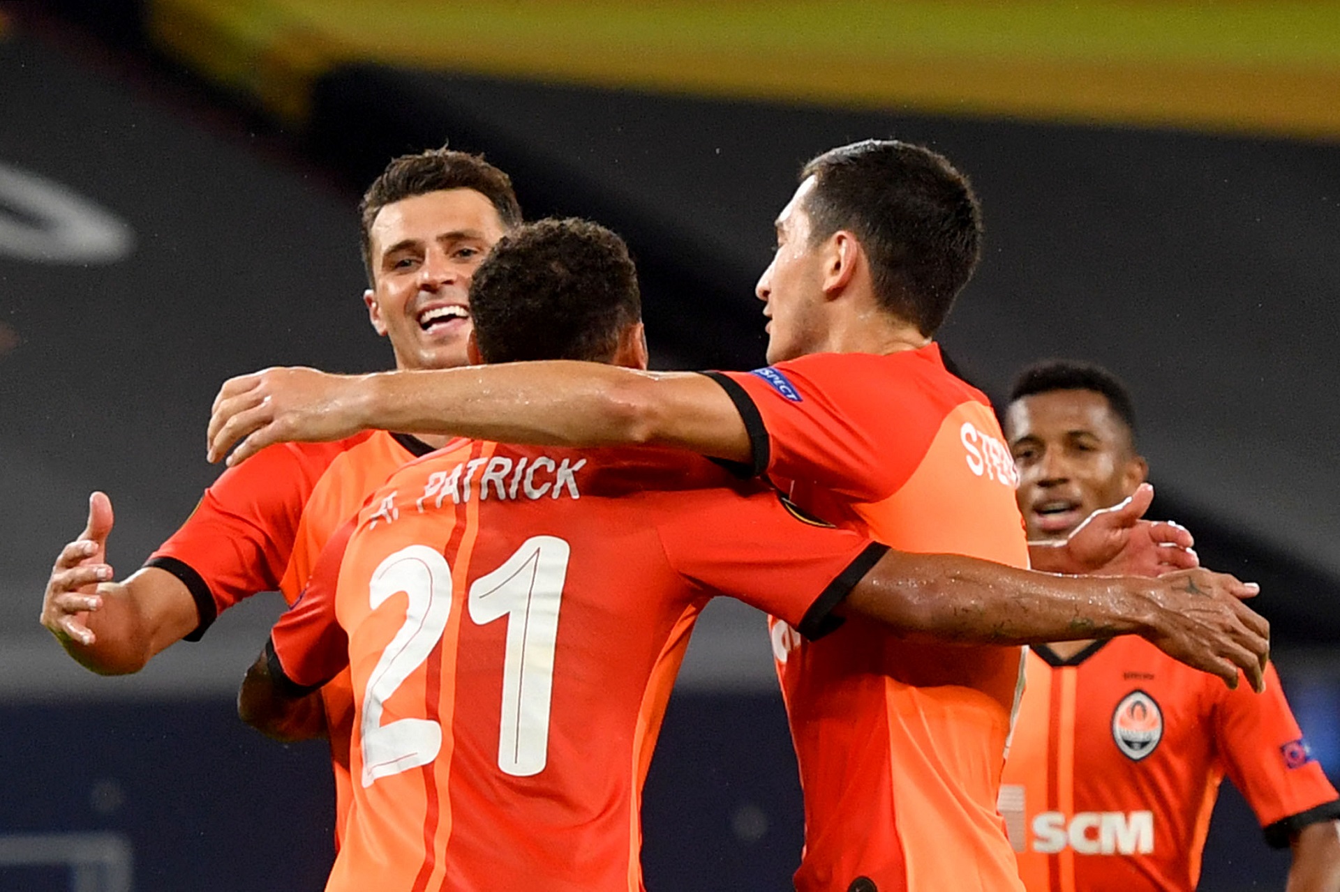 11 August 2020, North Rhine-Westphalia, Gelsenkirchen: Shakhtar Donetsk's Alan Patrick (C) celebrates scoring his side's third goal with his team mates Junior Moraes (L) and Taras Stepanenko during the UEFA Europa League quarter-final soccer match between FC Shakhtar Donetsk and FC Basel at the Veltins-Arena. Photo: Bernd Thissen/dpa