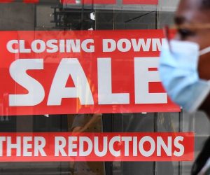epa08598936 A pedestrian passes a closing down sale at a store in London, Britain, 12 August 2020. According to news reports the UK is now officially in recession. Britain is set to experience its worst recession on record after data showed the Coronavirus sent the UK economy plunging by over twenty percent for the second quarter of 2020.  EPA/ANDY RAIN