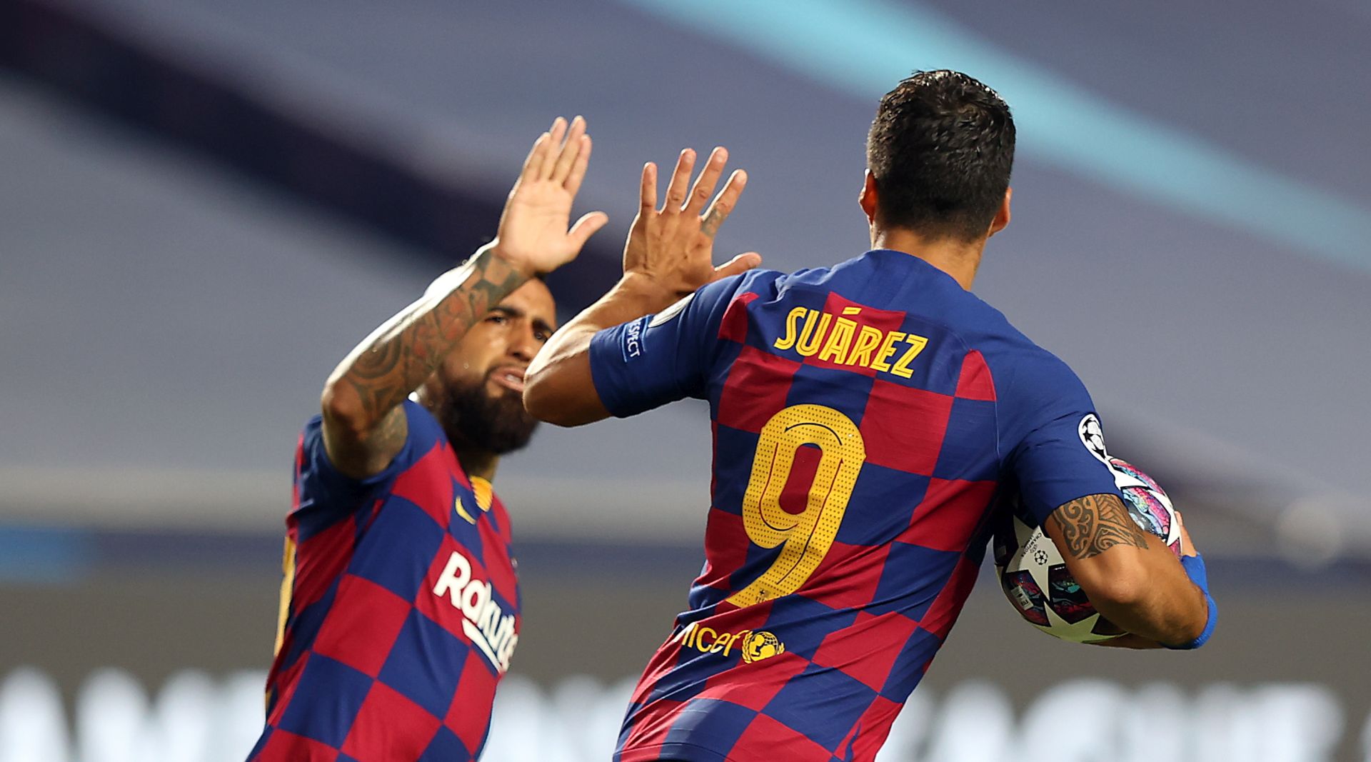 epa08604349 Luis Suarez (R) of Barcelona celebrates with Arturo Vidal of Barcelona after scoring the second goal for his team during the UEFA Champions League quarter final match between Barcelona and Bayern Munich in Lisbon, Portugal, 14 August 2020.  EPA/Rafael Marchante / POOL