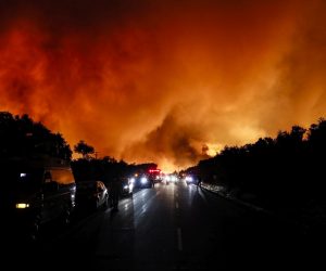 epaselect epa08600363 Firefighters evacuate and the winds pick up and forms a small fire tornado as the Lake Fire continues its progress in Lake Hughes, California, USA, 12 August 2020. According to the latest media report the fire burnt 10,000 acres.  EPA/ETIENNE LAURENT