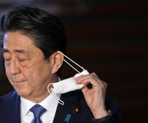 epa08608398 (FILE) - Japanese Prime Minister Shinzo Abe takes off his face mask as he arrives at a press conference at the prime minister's official residence in Tokyo, Japan, 06 April 2020 (reissued 17 August 2020). According to Japanese government sources, Abe, who entered a hospital in Tokyo for a medical check-up on 17 August, plans to return home later in the day. A top government official was reportedly concerned that Abe was suffering from fatigue due to the workload amid the ongoing coronavirus pandemic crisis.  EPA/FRANCK ROBICHON