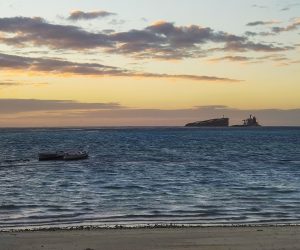 epa08610460 A view from the beach of Pointe D'Esny of the two parts of the MV Wakashio, a Japanese owned Panama-flagged bulk carrier after it split in two following running aground off the southeast coast of Mauritius, 17 August 2020 (issued 18 August 2020). The ship was sailing from China to Brazil when it hit coral reefs near Pointe d'Esny on 25 July 2020. Oil from the grounded ship is damaging protected marine ecosystems.  EPA/REUBEN PILLAY