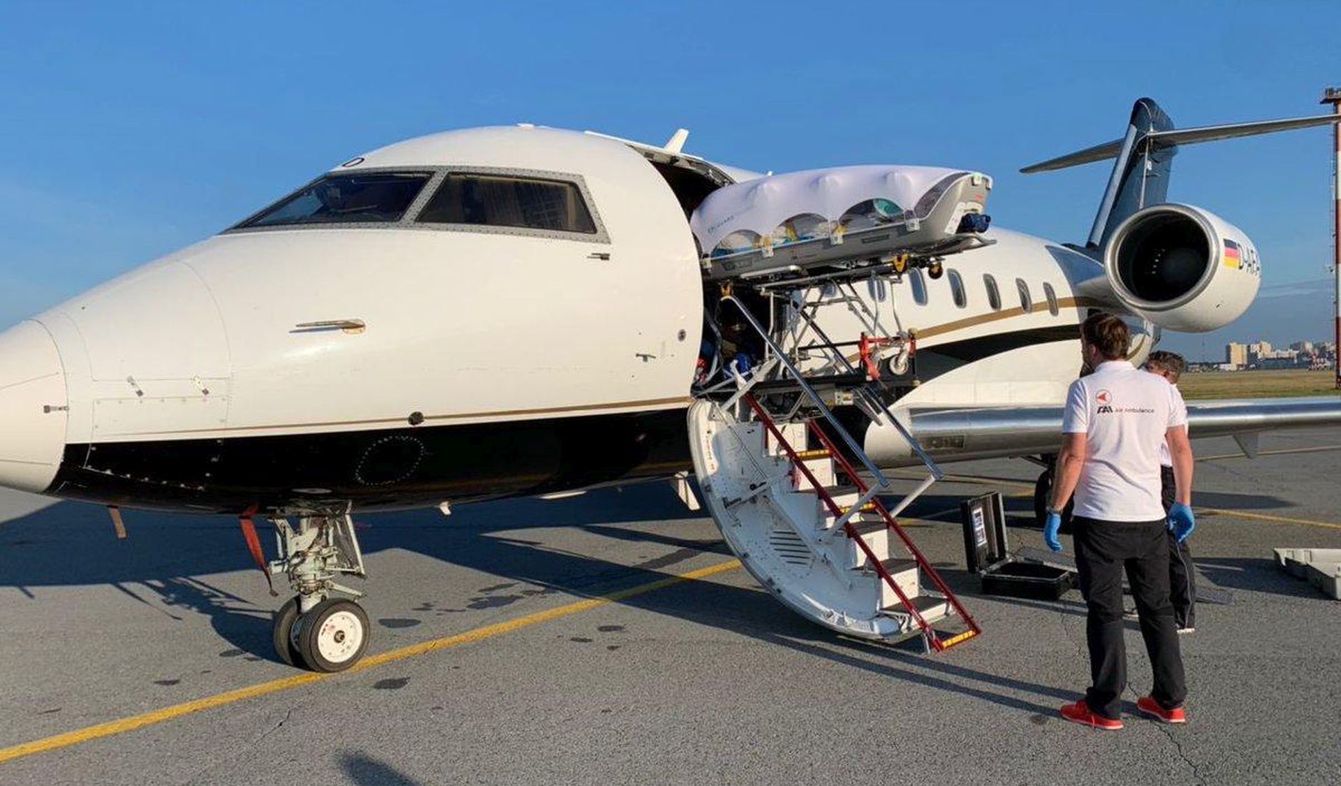 epa08617591 A handout photo made available by Team Navalny_Omsk shows the loading of a medical plane before the departure of Russian opposition leader Alexei Navalny from an emergency care hospital to Germany, in Omsk, Russia, 22 August 2020. Opposition leader Alexei Navalny was placed in the hospital after he fell ill on board a plane on his way from Tomsk to Moscow. The flight was interrupted and after landing in Omsk the opposition activist Alexei Navalny was delivered to the hospital with a suspicion of toxic poisoning. His treatment will be continued in German clinic Charirite after demands of his relatives.  EPA/KIRA YARMYSH / HANDOUT  HANDOUT EDITORIAL USE ONLY/NO SALES