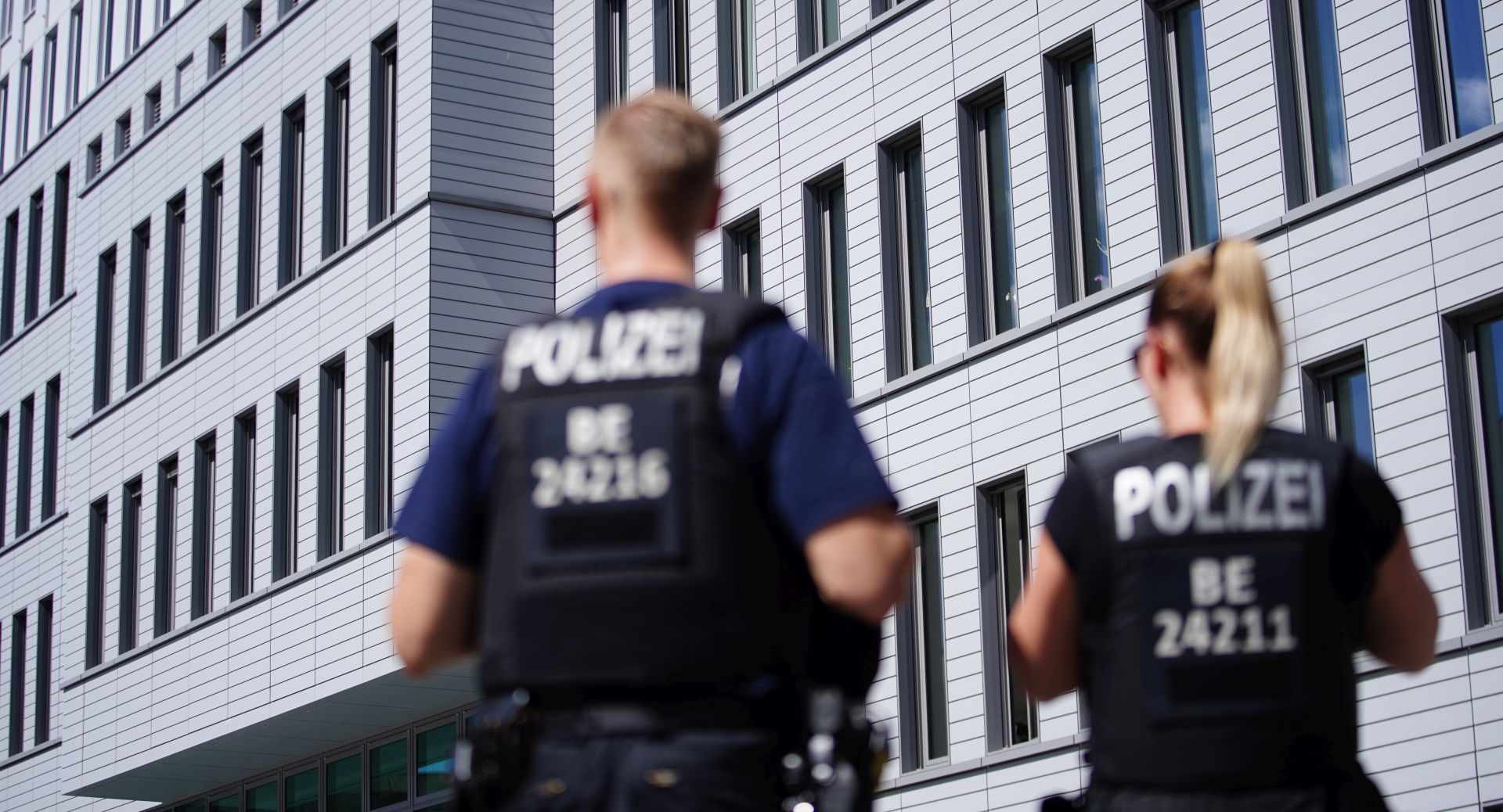 epa08619501 Members of police stand in front of Charite clinic where Russian opposition activist Alexei Navalny (not in the picture) stays for treatment in Berlin, Germany, 23 August 2020. Navalny was first placed in an hospital in Omsk, Russia, after he felt bad on board of a plane on his way from Tomsk to Moscow. The flight was interrupted and after landing in Omsk Navalny was delivered to hospital with a suspicion on a toxic poisoning. The hospital management agreed on 21 August 2020 to transport Navalny to a German hospital for further treatment.  EPA/CLEMENS BILAN