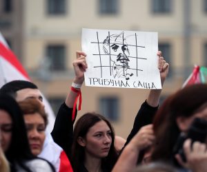 epa08619646 Opposition activists shout slogans and hold placard showing a drawing of Lukashenko in a prison cage, during a protest march against the results of the presidential elections, in Minsk, Belarus 23 August 2020. Opposition in Belarus alleges poll-rigging and police violence at protests following election results claiming that president Lukashenko had won a landslide victory in the 09 August elections.  EPA/TATYANA ZENKOVICH