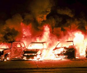 epa08623796 Automobiles burn after being set ablaze during a second night of unrest in the wake of the shooting of Jacob Blake by police officers, in Kenosha, Wisconsin, USA, 24 August 2020. According to media reports Jacob Blake, a black man, was shot by a Kenosha police officer or officers responding to a domestic distubance call on 23 August, setting off protests and unrest. Blake was taken by air ambulance to a Milwaukee, Wisconsin hospital and protests started after a video of the incident was posted on social media.  EPA/TANNEN MAURY