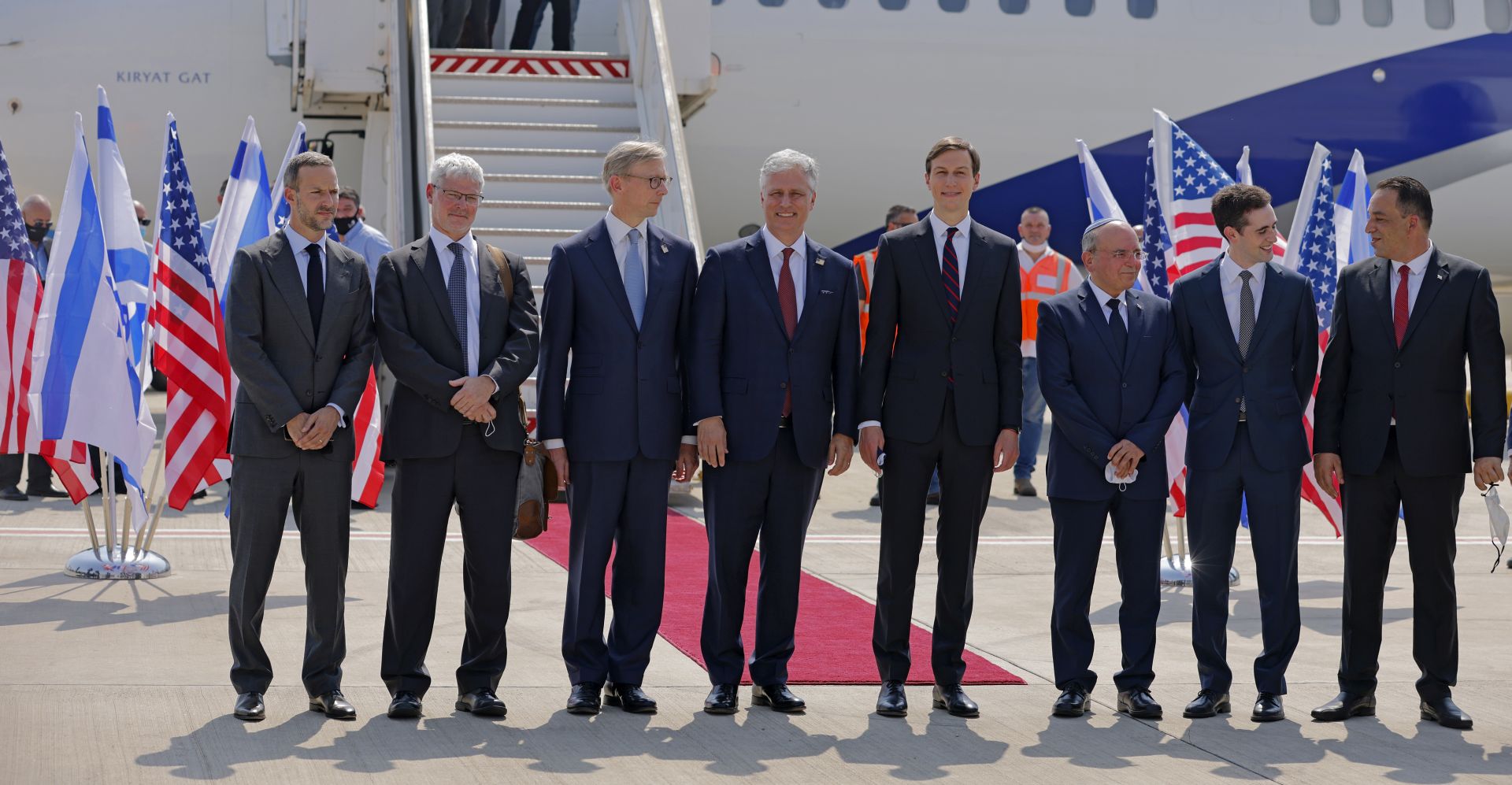 epa08636826 US Presidential Adviser Jared Kushner (C-R) and US National Security Adviser Robert O’Brien (C-L) pose with members of the Israeli-American delegation in front of the El Al's flight LY971, which will carry the delegation from Tel Aviv to Abu Dhabi, at the Ben Gurion Airport near Tel Aviv, Israel, 31 August 2020. The El Al flight, scheduled to leave at 0730 GMT from Ben Gurion Airport near Tel Aviv, will carry a delegation led on the American side by President Donald Trump's son-in-law and White House advisor Jared Kushner.  EPA/MENAHEM KAHANA / POOL