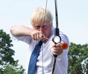 Britain's PM Johnson visits Premier Education Summer Camp at Sacred Heart of Mary Girls' in Upminster Britain's Prime Minister Boris Johnson takes part in an archery session as he visits Premier Education Summer Camp at Sacred Heart of Mary Girls', as the coronavirus disease (COVID-19) outbreak continues, in Upminster, London, Britain August 10, 2020. Lucy Young/Pool via REUTERS     TPX IMAGES OF THE DAY POOL