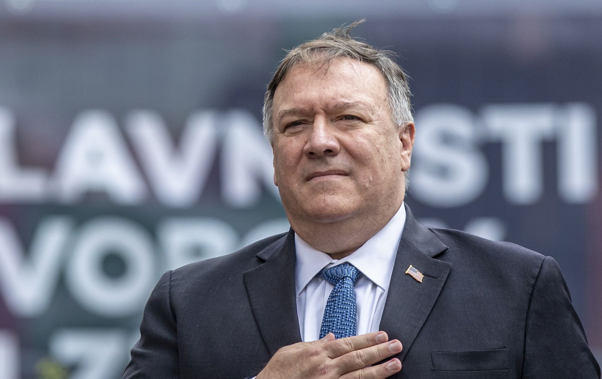 epa08597506 US Secretary of State Mike Pompeo listens to US national anthem as he commmemorates the liberation of Western Czechoslovakia by the US army at the end of WWII, at the monument 'Thank you America!' in Plzen, Czech Republic, 11 August 2020. Pompeo is on an official two-day visit to the Czech Republic.  EPA/MARTIN DIVISEK