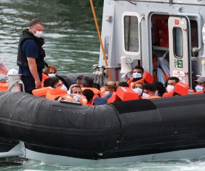 epa08612523 A Border Force vessel brings in migrants found off the coast of Dover in Dover, Kent, Britain, 19 August 2020. Britain and France are continuing ongoing talks to try to resolve the migrant crisis in the English Channel. Migrants from Syria and other countries are continuing to arrive along the coast of the UK in their quest for asylum.  EPA/ANDY RAIN