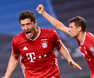 epa08613554 Robert Lewandowski (L) of Bayern Munich  celebrates scoring the 3-0 lead during the UEFA Champions League semi final match between Olympique Lyon and Bayern Munich in Lisbon, Portugal, 19 August 2020.  EPA/Franck Fife / POOL