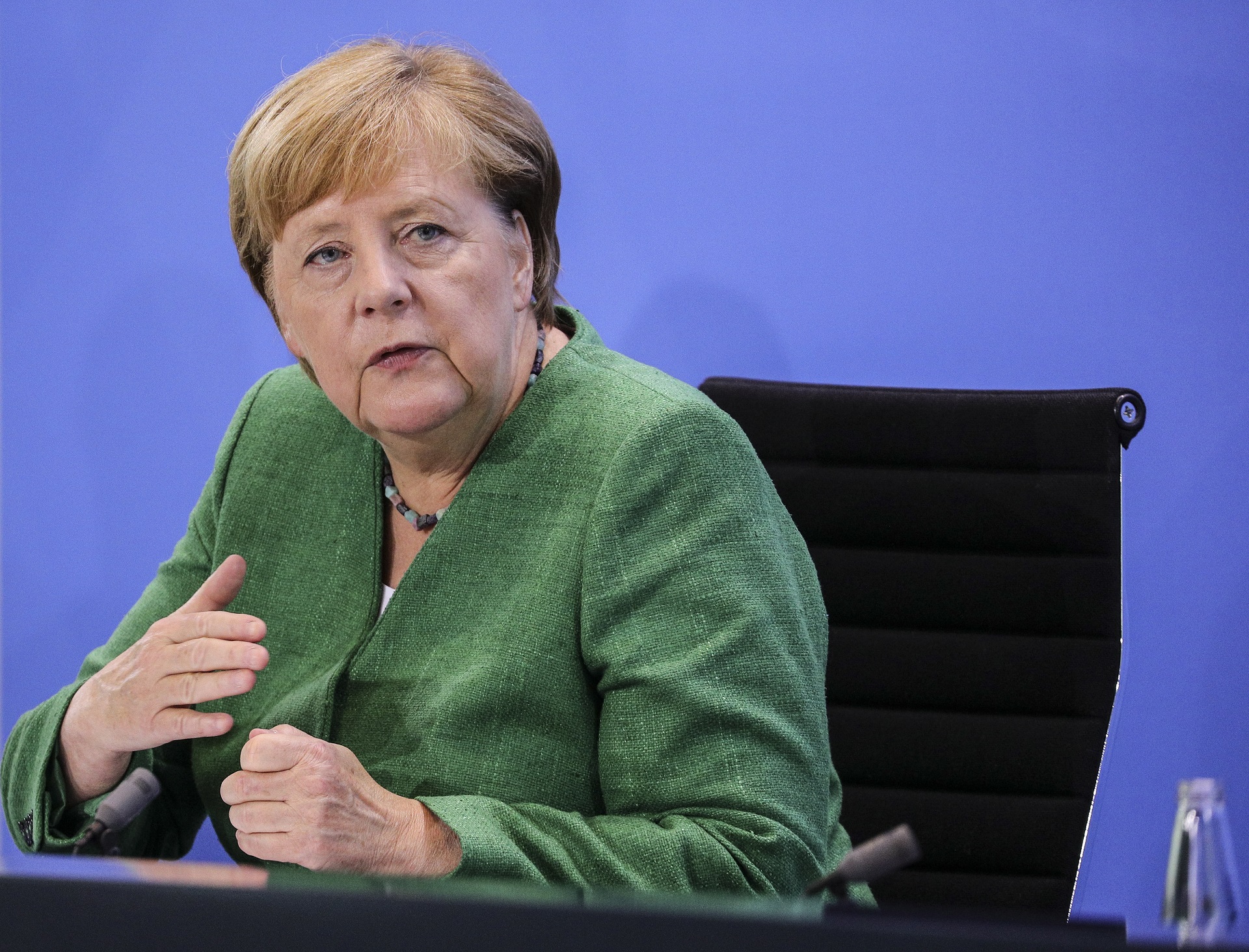 epa08629412 German Chancellor Angela Merkel speaks to the media with Bavarian Governor Markus Soeder and Hamburg Mayor Peter Tschentscher (not pictured) following a virtual meeting with governors of Germany's 16 states at the Chancellery during the coronavirus pandemic in Berlin, Germany, 27 August 2020. High on the agenda of the meeting was the limit on the number of people who may attend private gatherings in Germany in light of a recent uptick in coronavirus infections. Each state currently decides on the limit and the numbers vary widely nationwide.  EPA/Omer Messinger / POOL