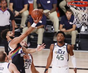 epa08640418 Denver Nuggets guard Jamal Murray (C) drives between Utah Jazz players (L-R) Joe Ingles, Rudy Gobert of France and Donovan Mitchell during the first half of the NBA basketball first round Western Conference playoff game seven between the Utah Jazz and the Denver Nuggets at the ESPN Wide World of Sports Complex in Kissimmee, Florida, USA, 01 September 2020.  EPA/ERIK S. LESSER SHUTTERSTOCK OUT