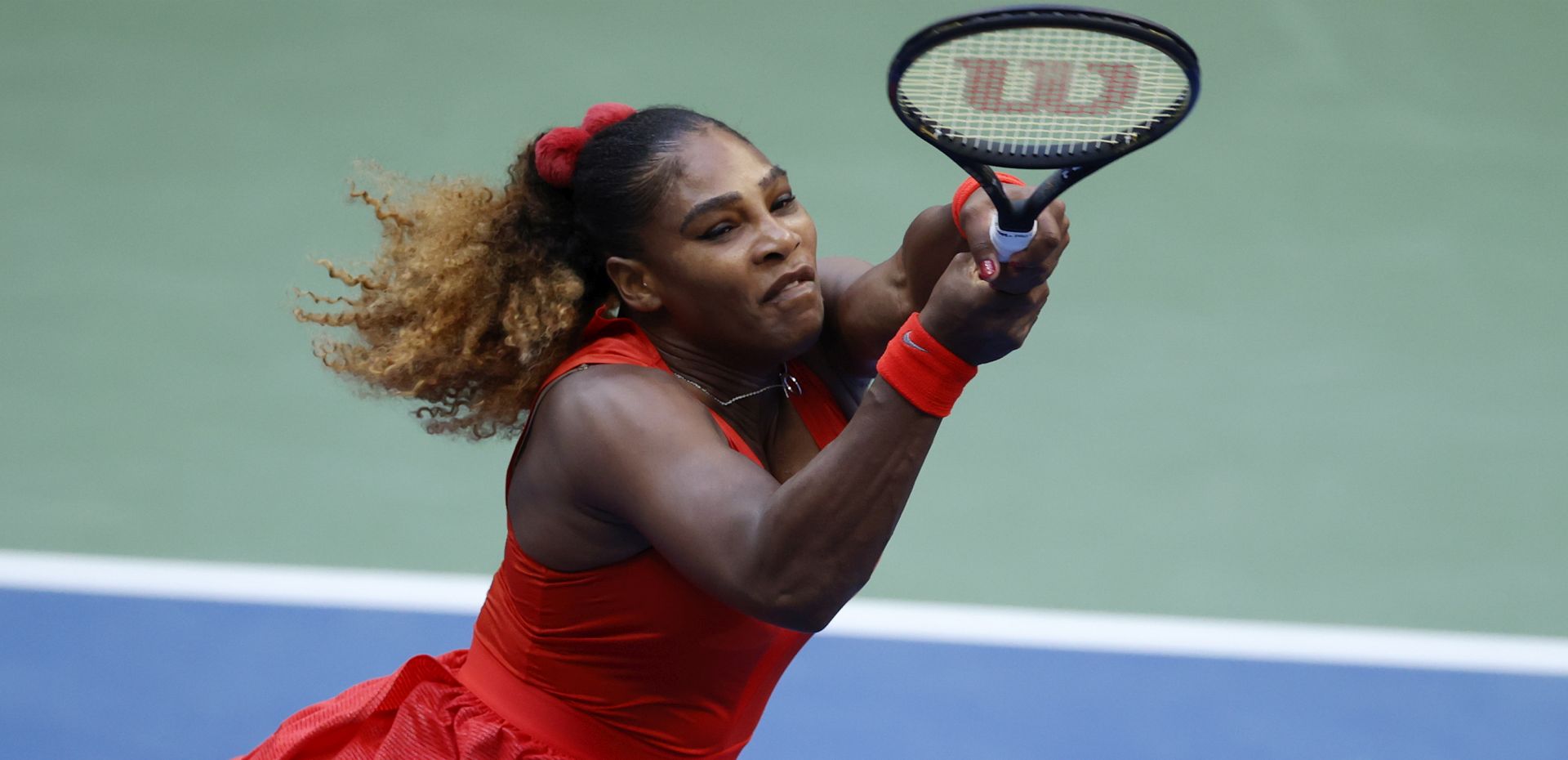 epa08640306 Serena Williams of the US hits a return to Kristie Ahn of the US during their match on the second day of the US Open Tennis Championships the USTA National Tennis Center in Flushing Meadows, New York, USA, 01 September 2020. Due to the coronavirus pandemic, the US Open is being played without fans and runs from 31 August through 13 September.  EPA/JASON SZENES