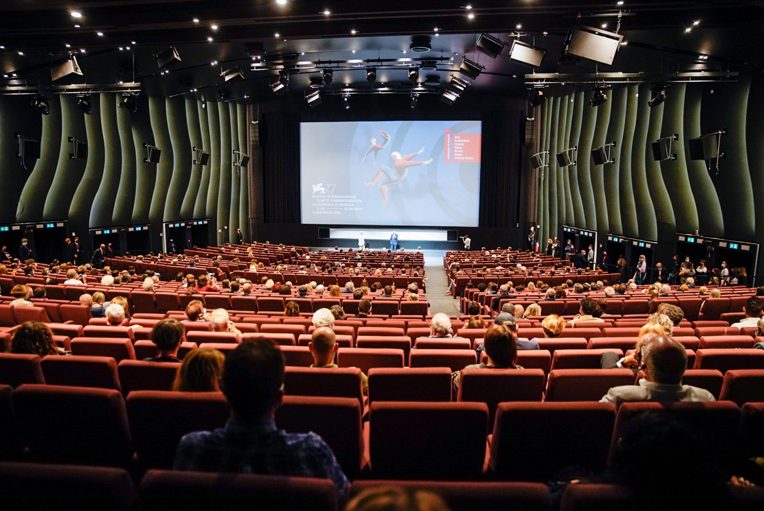 epa08640263 Spectators at the new film by director Andrea Segre screening, the docufilm 'Molecole', made in the Venice during lockdown  for the coronavirus presented in the Sala Darsena and at the PalaBiennale at the 77th annual Venice International Film Festival, in Venice, Italy, 01 September 2020.  EPA/STR