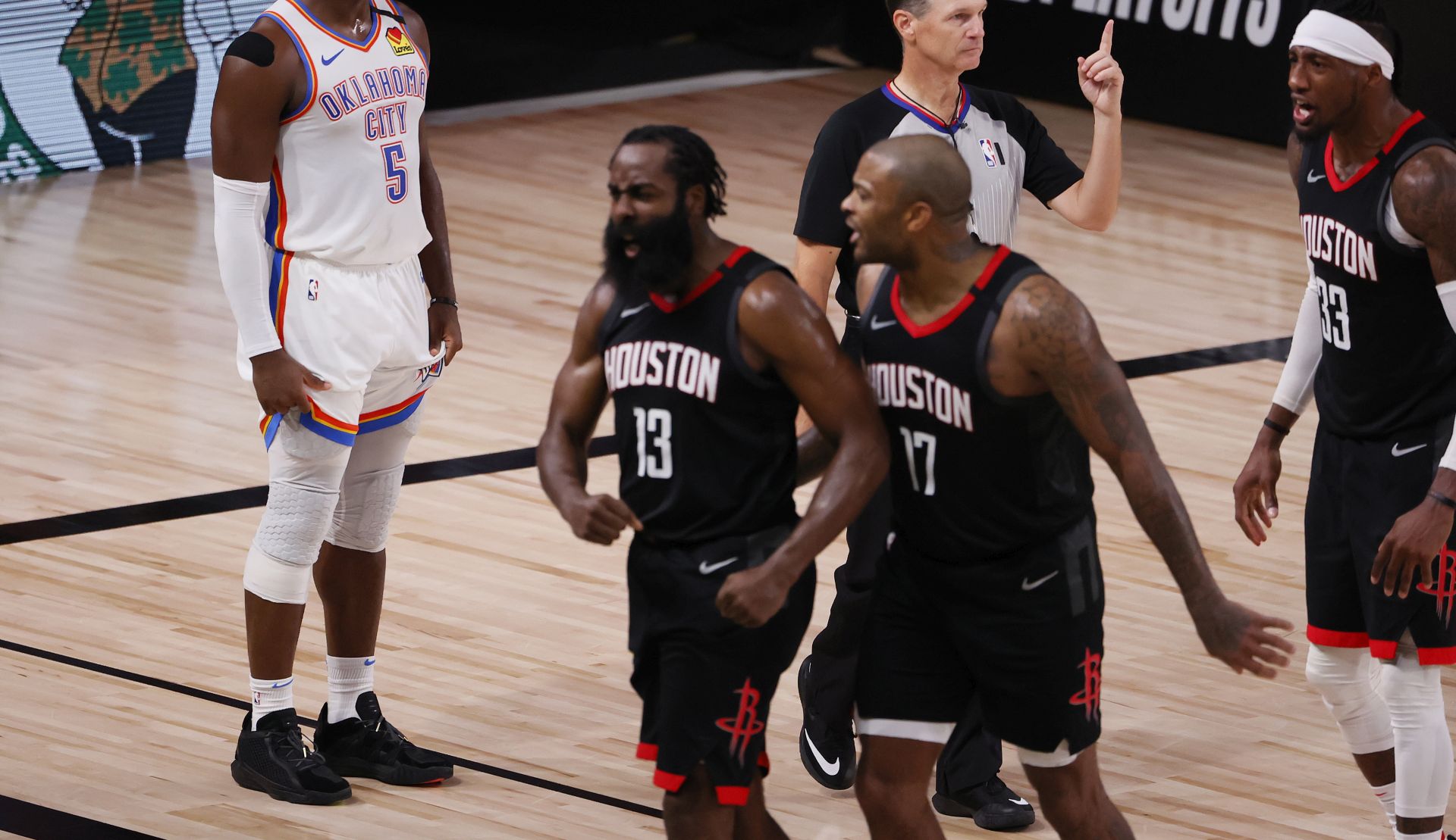 epa08642889 Oklahoma City Thunder guard Luguentz Dort (L) of Canada looks away as Houston Rockets guard James Harden (C) reacts after making a crucial defensive play as an official calls for a replay in the final seconds of the NBA basketball first round Western Conference playoff game seven between the Oklahoma City Thunder and Houston Rockets at the ESPN Wide World of Sports Complex in Kissimmee, Florida, USA, 02 September 2020.  EPA/ERIK S. LESSER SHUTTERSTOCK OUT