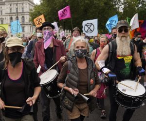 epa08643834 Members of climate change protest group Extinction Rebellion demonstrate outside the Treasury in Central London, Britain, 03 September 2020. Extinction Rebellion is a global environmental movement using civil disobedience to highlight climate and environmental issues. It is aiming for 10 days of protests starting on 01 September.  EPA/WILL OLIVER