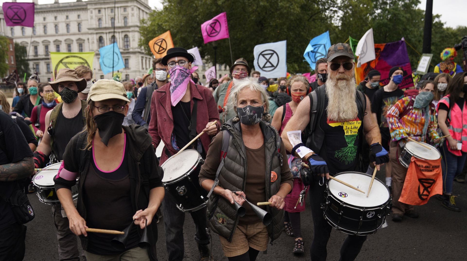 epa08643834 Members of climate change protest group Extinction Rebellion demonstrate outside the Treasury in Central London, Britain, 03 September 2020. Extinction Rebellion is a global environmental movement using civil disobedience to highlight climate and environmental issues. It is aiming for 10 days of protests starting on 01 September.  EPA/WILL OLIVER