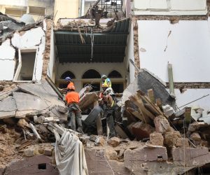 epa08644234 Rescue team from Chile work with Lebanese civil defense in a rescue mission after a scanner and a sniffer dog from the rescue team detected that there might be a survivor under the rubble at Mar Mikhael area in Beirut, Lebanon, 03 September 2020. According to Lebanese Health Ministry, at least 190 people were killed, and more than six thousand injured in the Beirut blast that devastated the port area on 04 August and believed to have been caused by an estimated 2,750 tons of ammonium nitrate stored in a warehouse.  EPA/WAEL HAMZEH