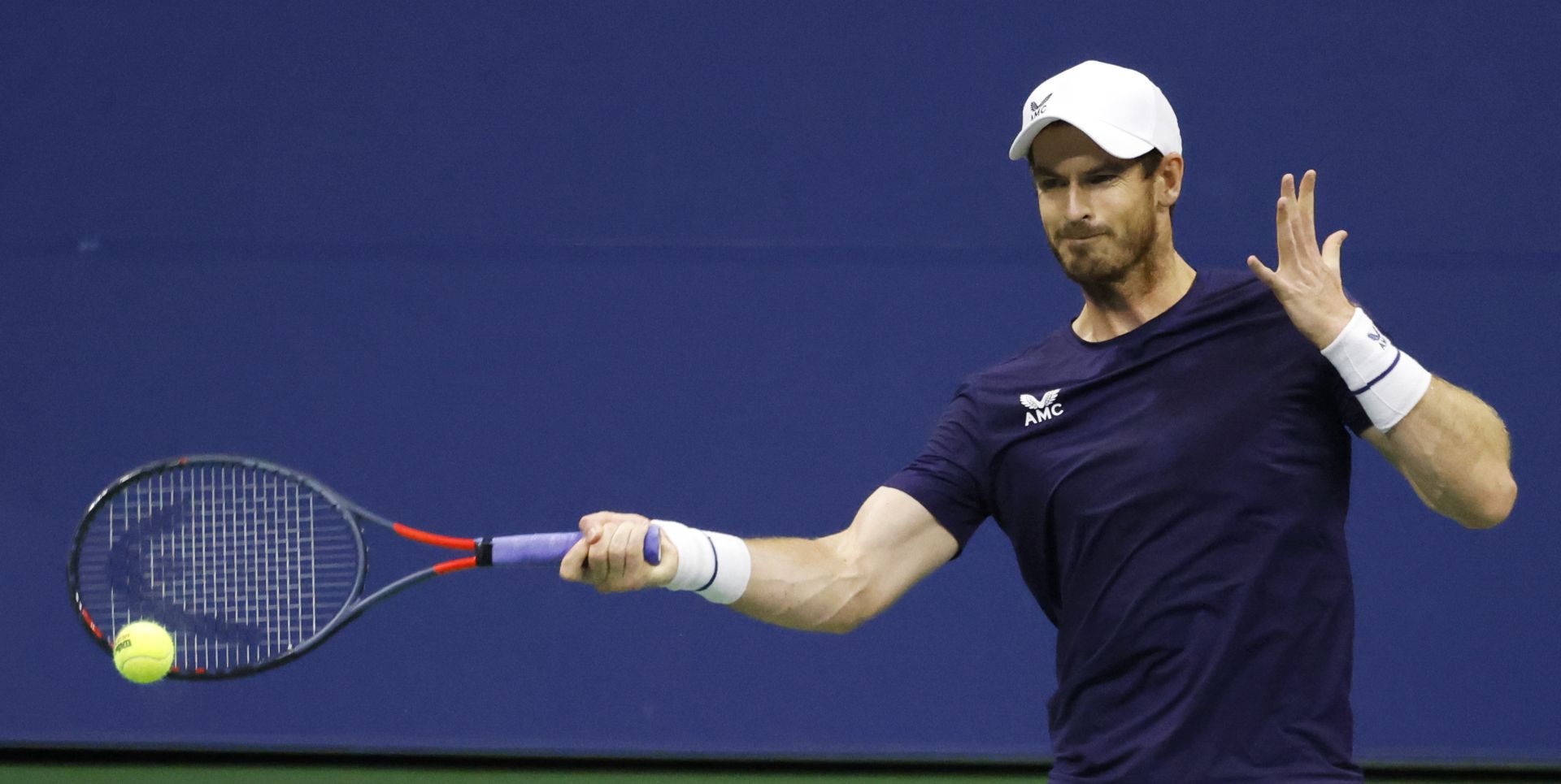 epa08645169 Andy Murray of Britain hits a return to Felix Auger-Aliassime of Canada during their match on the fourth day of the US Open Tennis Championships the USTA National Tennis Center in Flushing Meadows, New York, USA, 03 Septemeber 2020. Due to the coronavirus pandemic, the US Open is being played without fans and runs from 31 August through 13 September.  EPA/JASON SZENES