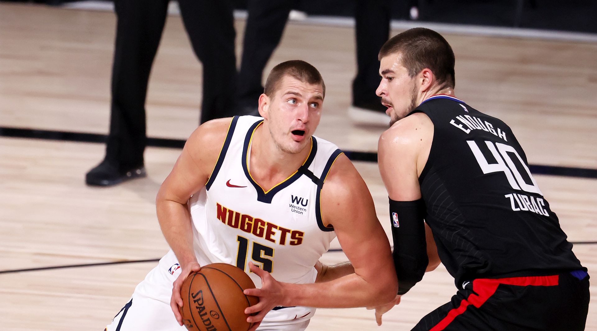 epa08645176 Denver Nuggets center Nikola Jokic (L) Serbia goes to the basket as Los Angeles Clippers center Ivica Zubac (R) of Croatia defends during the first half of the NBA basketball Western Conference semifinals playoff game one between the Denver Nuggets and Los Angeles Clippers at the ESPN Wide World of Sports Complex in Kissimmee, Florida, USA, 03 September 2020.  EPA/ERIK S. LESSER SHUTTERSTOCK OUT