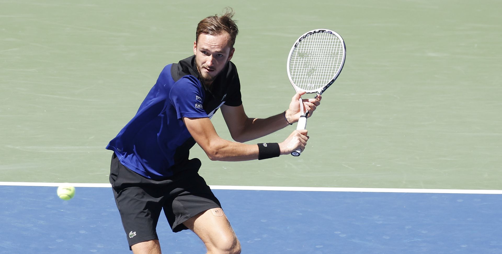 epa08649440 Daniil Medvedev of Russia hits a return to J.J. Wolf of the US during their match on the sixth day of the US Open Tennis Championships the USTA National Tennis Center in Flushing Meadows, New York, USA, 05 September 2020. Due to the coronavirus pandemic, the US Open is being played without fans and runs from 31 August through 13 September.  EPA/JASON SZENES