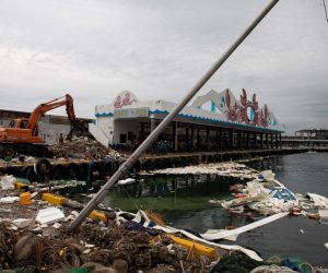 epa08650254 Local residents and forklift, clean up the fishing items that have been damaged by strong winds from the powerful Typhoon Maysak on 02 September at Imwon harbor on Donghae city in Gangwon-do province, South Korea, 06 September 2020. Korea's Meteorological Administration (KMA) said, Typhoon Haishen approaches toward Korean Peninsula at a speed of 22 kilometers per hour from around 290 kilometers northeast of Okinawa.  EPA/JEON HEON-KYUN