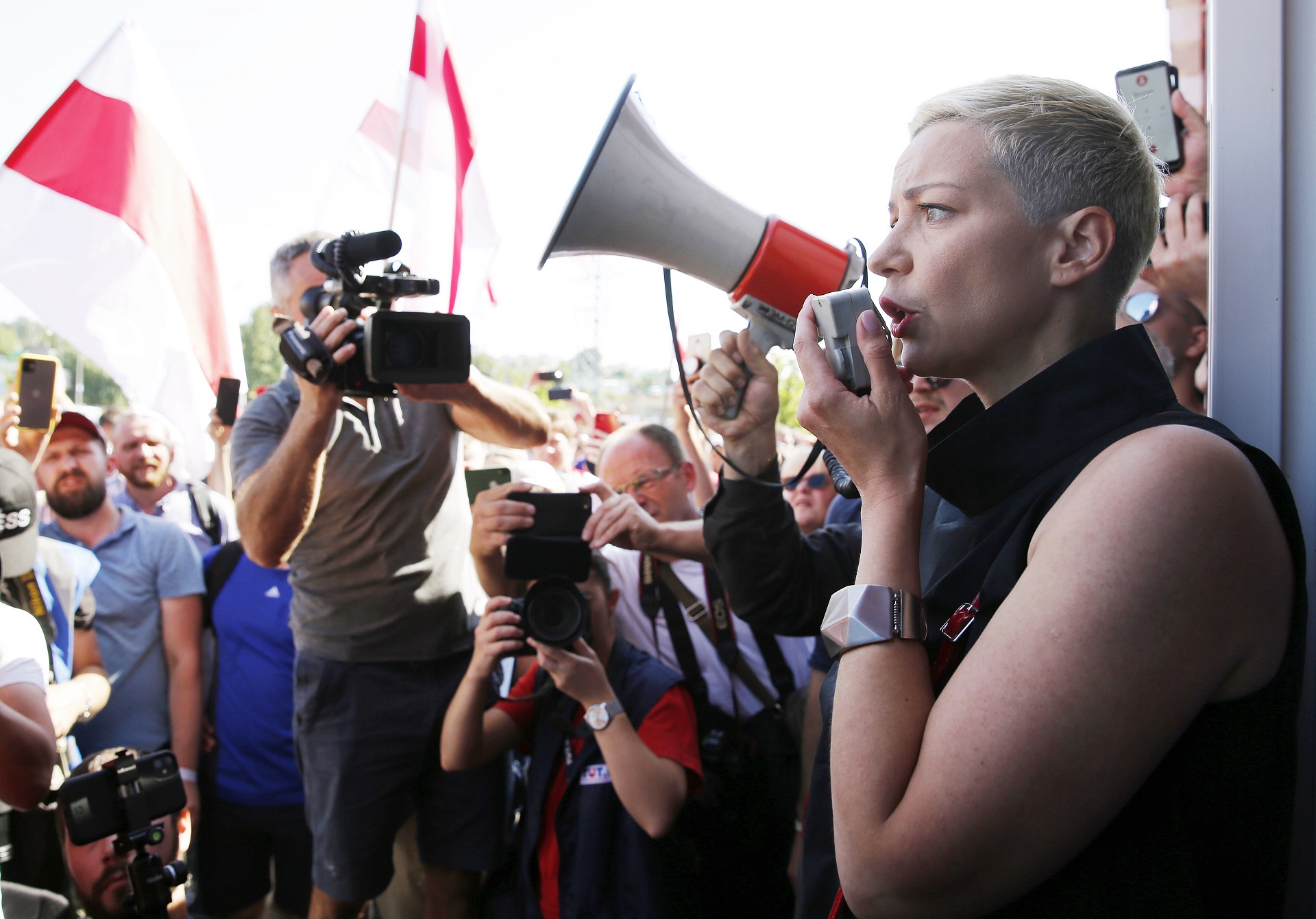 epa08652179 (FILE) -  Maria Kolesnikova (R) a representative of non-registered presidential candidate Victor Babariko, addresses workers of the Minsk Wheeled Tractor Plant during a strike and protest rally as Belarus president Lukashenko (unseen) visits their plant, in Minsk, Belarus, 17 August 2020 (reissued 07 September 2020). According to media reports citing eyewitnesses and fellow campaign members, Kolesnikova has been detained by unidentified persons in Minsk on 07 September.  EPA/TATYANA ZENKOVICH *** Local Caption *** 56293267