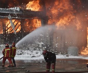 epa08658807 Lebanese firefighters try to extinguish a fire at a Port of Beirut, Lebanon, 10 September 2020. A massive fire is raging at the port of Beirut, a little more than a month after a huge explosion rocked the harbor facilities and surrounding area. The cause of the fire was not immediately kn​own.  EPA/WAEL HAMZEH