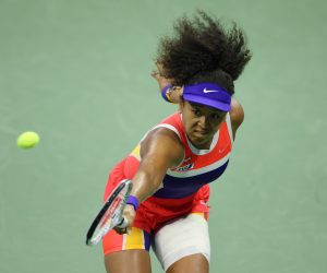 epa08660309 Naomi Osaka of Japan hits a return to Jennifer Brady of the US during their Women's Semifinal match on the eleventh day of the US Open Tennis Championships the USTA National Tennis Center in Flushing Meadows, New York, USA, 10 September 2020. Due to the coronavirus pandemic, the US Open is being played without fans and runs from 31 August through 13 September.  EPA/JUSTIN LANE